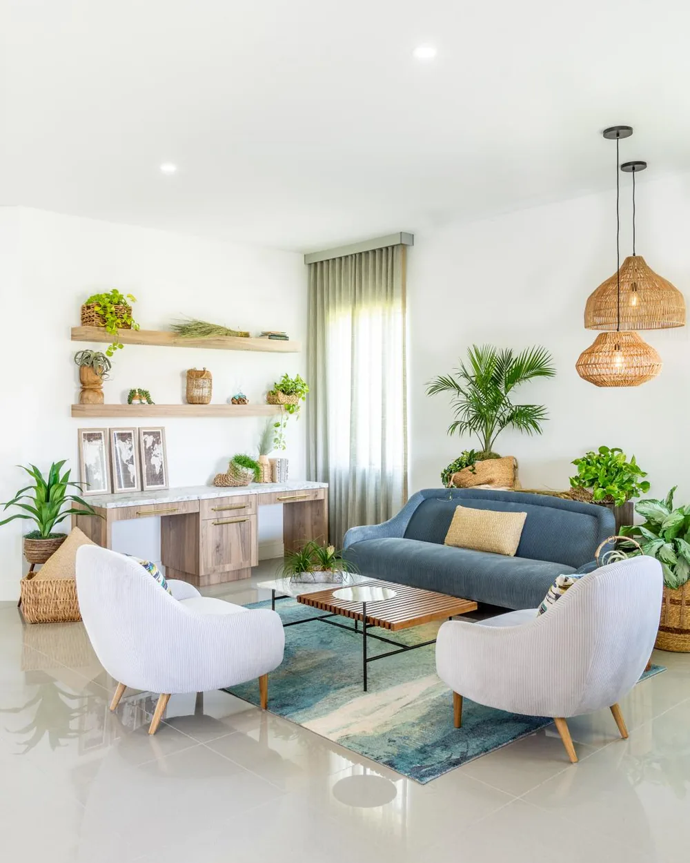 A living room with layered planting by Twice The Style