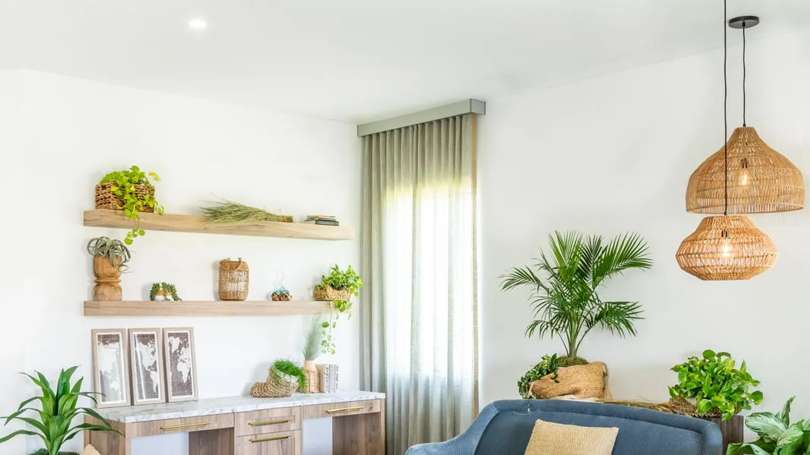 A living room with layered planting, designed by Twice The Style